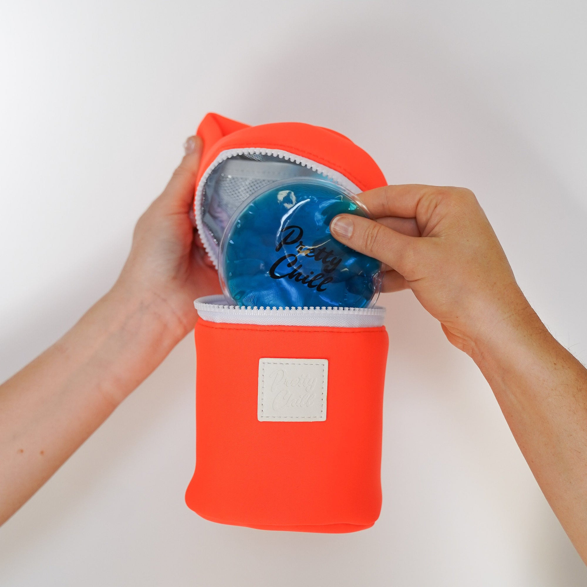 person holding makeup bag with ice pack 